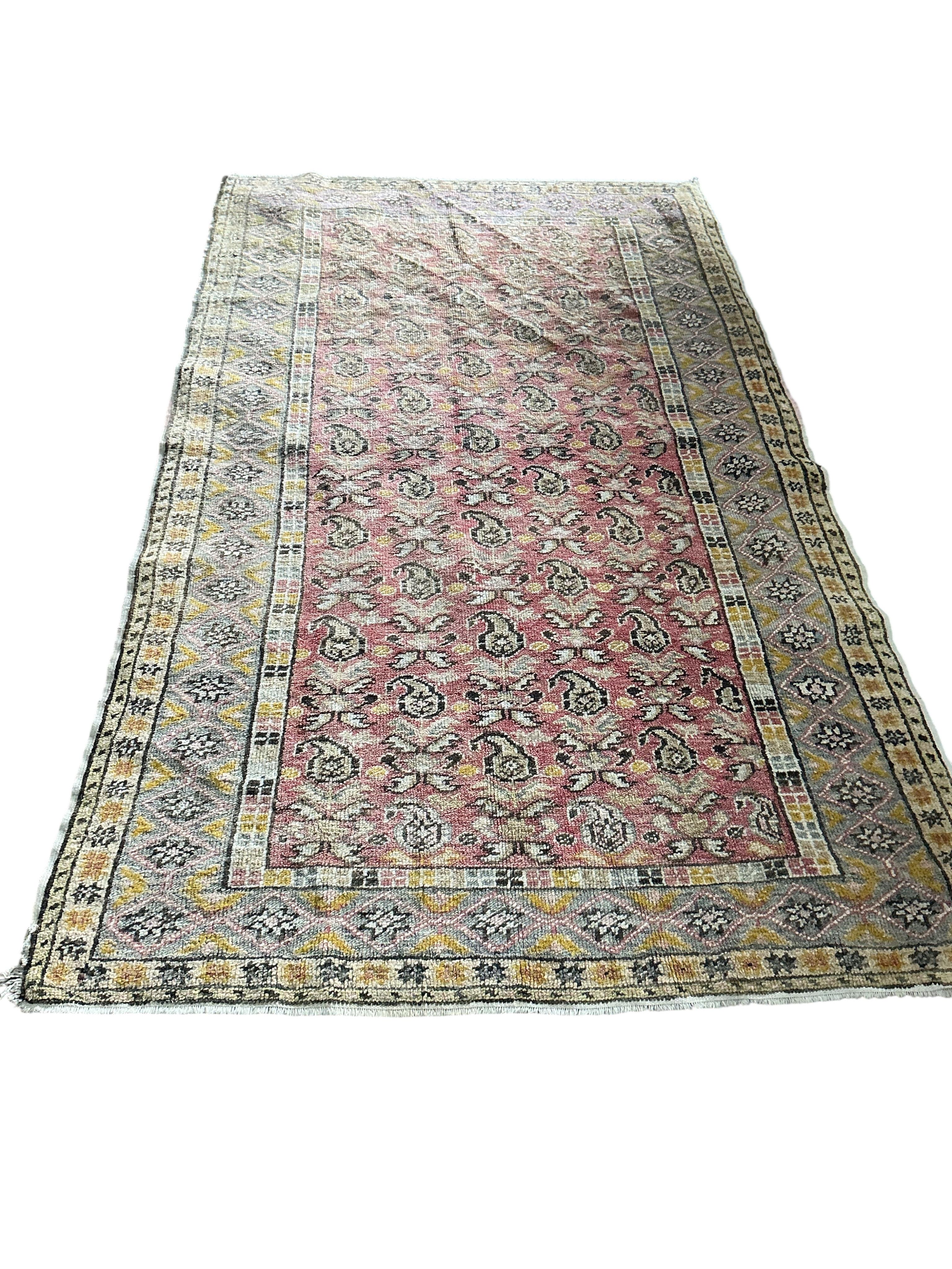 A Turkish pale red ground boteh rug, 194 x 158cm